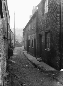 Prints of Uxbridge, Nashs yard. Slum clearance. Inhabitants of Bakers Yard, Nashs Yard, Bell yard and York Road moved to new estate off Glebe Road, Austin Way 9th December 1932 Slums Prints: Uxbridge Slum Clearance Print 1932: Nash's Yard Evictions