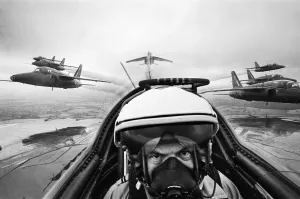 Prints of Daily Herald photographer Ron Burton in the cockpit of a Folland Gnat aircraft of the RAF Aerobatics team the Red Arrows as he joins the team on a training flight over RAF Little Rissington Gloucestershire Prints: Ron Burton in RAF Red Arrows Folland Gnat Print 1965