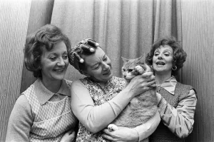 Prints of Coronation Streets Thelma Barlow (Mavis Riley), Jean Alexander (Hilda Ogden) and Barbara Knox (Rita Sullivan) with the Streets cat. November 1980 Rita Prints: Coronation Streets Legends Print - November 1980