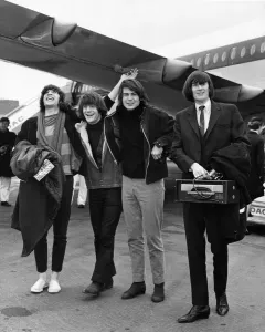 Prints of American pop group The Lovin Spoonful pop group arriving at London Airport from New York. They are led to right: Zal Yanovsky, John Sebastian, Joe Butler and Steve Boone 0900to0999 Prints: The Lovin Spoonful Arrive at London Airport Print 1966