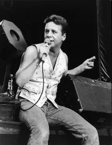 Prints of Jim Kerr, lead singer of the rock group Simple Minds entertains the crowd at the groups concert at The National Stadium, Cardiff Arms Park, Cardiff, Wales. Picture taken 5th August 1989 0900to0999 Prints: Jim Kerr Live at Cardiff Arms Park Print 5th August 1989