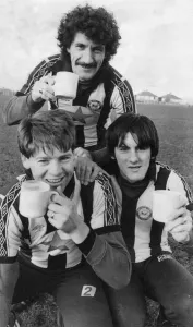 Prints of Newcastle United Players, Terry McDermott, Chris Waddle and Peter Beardsley enjoy a cup of tea ahead of training session at Benwell, Thursday 5th January 1984 1000to1099 Prints: Newcastle United Players 1984 Benwell Print