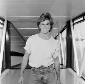 Prints of George Michael, singer from Wham ! arrives at Heathrow Airport from Paris today. George Michaels real name is Georgios Kyriacos Panayiotou Picture taken 22nd August 1984 1000to1099 Prints: George Michael Arrives at Heathrow Print August 1984