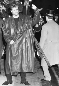 Prints of George Michael waves to fans outside the Savoy Hotel, where the launch party for his first solo album Faith was taking place. 31st October 1987 1000to1099 Prints: George Michael Waves to Fans at Savoy Hotel Print 1987