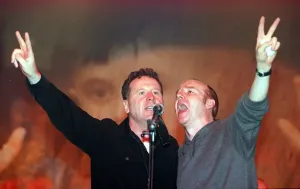 Prints of Jim Kerr of Simple Minds and Midge Ure May 1999 sing at the finale of the Scotland Rocks for Kosovo concert Kosovo Prints: Scotland Rocks for Kosovo Print - Kerr and Ure 1999
