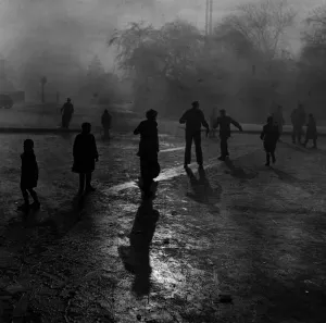 Prints of Fog and ice on Hampstead Heath. Boys sliding on the ice in the fog at Hampstead Heath ponds Weather Prints: Fog and Ice on Hampstead Heath Print, 7th December 1952