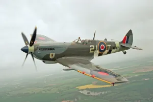 Prints of A Spitfire Mk IXe (ML417) of the Fighter Collection seen here in the skies above Duxford, Cambridgeshire, during rehearsals for the 1998 Spitfire Airshow. 30th May 1998 Aviation Prints: Spitfire Mk IXe Print - Duxford 1998