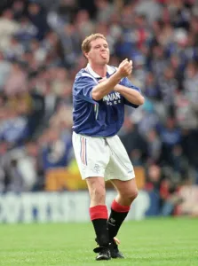 Prints of Glasgow Rangers footballer Paul Gascoigne making a one finger gesture while sticking out his tongue during the match against Hearts in the Scottish cup final at Hampden Park 1200to1299 Prints: Paul Gascoigne 1996 Scottish Cup Final Print - Hampden Park