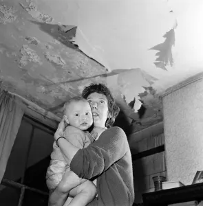 Prints of Slum housing in Salford. Mrs Moore and her 1 year old son Peter. Their home has two rooms up and two rooms down. There is no bath or hot water. There is one tap Greater Manchester Prints: Slum Housing in Salford, 3rd April 1960 Print