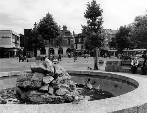 Prints of Victorian and modern mingle in the centre of Hyde, Greater Manchester. The pleasant new square by the main shopping market. Circa 1975 Greater Manchester Prints: Victorian and Modern Mingle in Hyde, circa 1975 Print