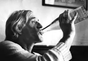 Prints of Richard Harris drinking from bottle of water during interview - 22 July 1982 1400to1499 Prints: Richard Harris Print: 1982 Interview Photo