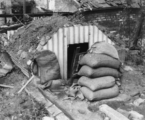 Print of an Anderson air raid shelter in a Bristol garden with sandbags