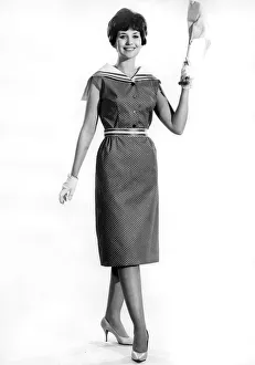 Model Ann Cave wearing a stylish sleveless three quarter length dress Model Ann Cave wearing a stylish sleveless three quarter length dress
