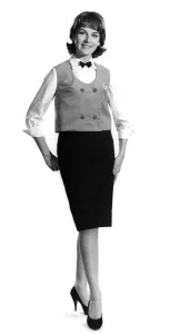 Model Diana Lovell wearing shirt bow tie and waistcoat with knee length skirt Model Diana Lovell wearing shirt bow tie and waistcoat with knee length skirt