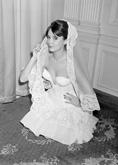Model Helga Allgoaoer modelling a dress designed by Hans Ostergard - a white fitted Model Helga Allgoaoer modelling a dress designed by Hans Ostergard - a white fitted