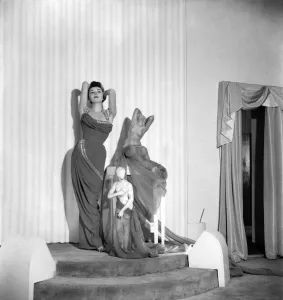 Model June Sweetzer poses wearing an elegant long dress. September 1952 C4772 Model June Sweetzer poses wearing an elegant long dress. September 1952 C4772