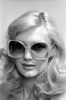 Model Maria wearing a pair of sunglasses. June 1980 80-03010-002 Model Maria wearing a pair of sunglasses. June 1980 80-03010-002