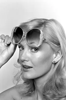 Model Maria wearing a pair of sunglasses. June 1980 80-03010-003 Model Maria wearing a pair of sunglasses. June 1980 80-03010-003