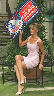 Model Paula Hamilton holds up the National Lottery Instants card Model Paula Hamilton holds up the National Lottery Instants card