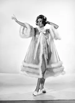 Model Rita Royce wearing marabou fur trimmed nightie. December 1963 Model Rita Royce wearing marabou fur trimmed nightie. December 1963