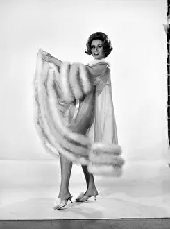 Model Rita Royce wearing marabou fur trimmed nightie. December 1963 Model Rita Royce wearing marabou fur trimmed nightie. December 1963
