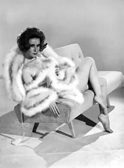 Model Rita Royce wearing marabou fur trimmed nightie. December 1963 Model Rita Royce wearing marabou fur trimmed nightie. December 1963