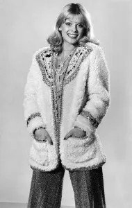 Model Sharron Lynne wearing fluffy cardigan, hands in pockets Model Sharron Lynne wearing fluffy cardigan, hands in pockets