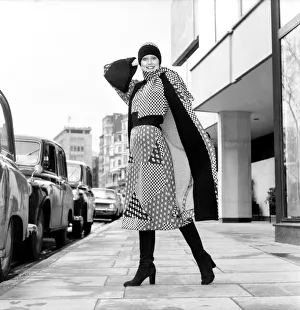 Model wearing a checkered and patterned dress with matching skirt Model wearing a checkered and patterned dress with matching skirt