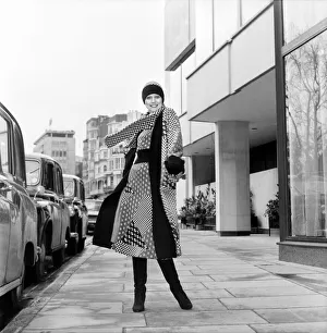 Model wearing a checkered and patterned dress with matching skirt Model wearing a checkered and patterned dress with matching skirt