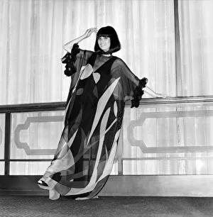 Model wearing a dress with see through garment on top during a Japanese Fashion Show Model wearing a dress with see through garment on top during a Japanese Fashion Show