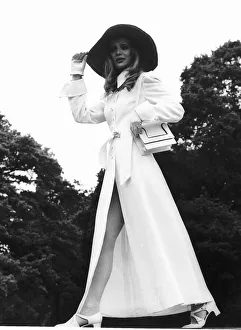 Model wears long white coat at Royal Ascot in June 1969 with floppy hat Model wears long white coat at Royal Ascot in June 1969 with floppy hat