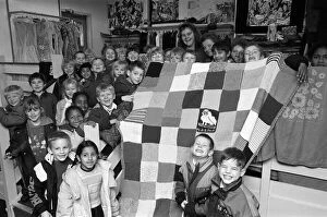 Related Images Collection: Moldgreen Junior and Infants School pulls with their knitted blanket