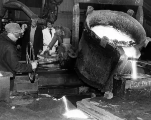 Molten metal is poured out by caster Brian Hunter at Parkfield Foundry, Stockton Molten metal is poured out by caster Brian Hunter at Parkfield Foundry, Stockton