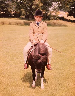 Moorland and Mountain Pony class at hiockstead. A young child riding on top of the pony Moorland and Mountain Pony class at hiockstead. A young child riding on top of the pony