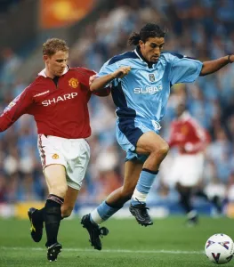 Moroccan-born Sky Blues player Moustapha Hadji and Manchester United's Nicky Butt Moroccan-born Sky Blues player Moustapha Hadji and Manchester United's Nicky Butt