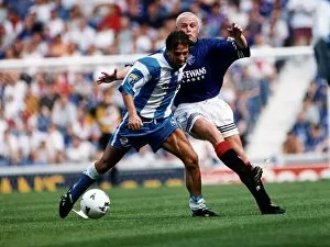 Images Dated 1st August 1995: Morton football player Derek McInnes holds off a challenge from Paul Gascoigne of Rangers