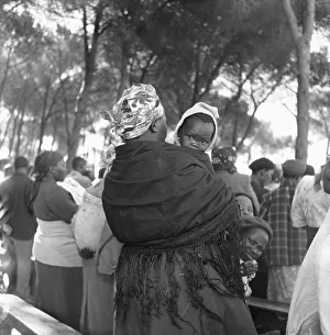 A mother carrying had child whilst attending a wedding in the Langa township A mother carrying had child whilst attending a wedding in the Langa township