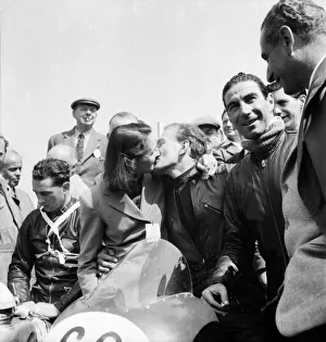 Motorsport. Isle of Man TT Races 1953 Les Graham receives the victors kiss Motorsport. Isle of Man TT Races 1953 Les Graham receives the victors kiss