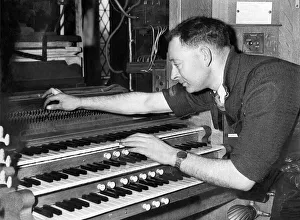 Mr. H. E. Prested test the action of an organ after re-assembly in May 1957 Mr. H. E. Prested test the action of an organ after re-assembly in May 1957