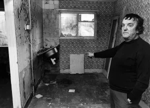 Mr John McGuire points to flood damage to his kitchen. Tower Hill Estate, Kirkby Mr John McGuire points to flood damage to his kitchen. Tower Hill Estate, Kirkby