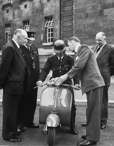 MrC J. Collishaw, RAC Training Organisor, explains the controls on the Vespa scooter MrC J. Collishaw, RAC Training Organisor, explains the controls on the Vespa scooter