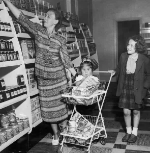 Mrs Freda Fox seen here selecting a jar of jam from the shelves of the new self service Mrs Freda Fox seen here selecting a jar of jam from the shelves of the new self service