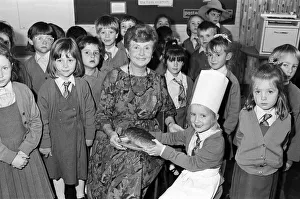 Mrs Rita Manchester receives a loaf of bread from six-year old Angela Chapman after a Mrs Rita Manchester receives a loaf of bread from six-year old Angela Chapman after a