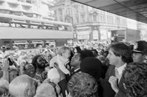 Muhammad Ali holds up a baby on his visit to Birmingham. 9th August 1983 Muhammad Ali holds up a baby on his visit to Birmingham. 9th August 1983