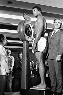 Muhammad Ali on the scales prior to his fight with Alvin Lewis, aka Blue Lewis Muhammad Ali on the scales prior to his fight with Alvin Lewis, aka Blue Lewis