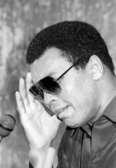 Muhammad Ali seen here at the post fight press conference following his lost to Larry Muhammad Ali seen here at the post fight press conference following his lost to Larry