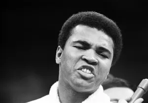 Muhammad Ali talking to the press in his training camp ahead of his first fight with Joe Muhammad Ali talking to the press in his training camp ahead of his first fight with Joe