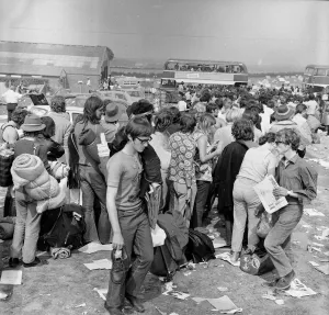 Music fans leaving The Isle of Wight Festival. 30th August 1970 Music fans leaving The Isle of Wight Festival. 30th August 1970