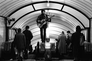 A musician busking at Oxford Circus Station - February 1987 standing A musician busking at Oxford Circus Station - February 1987 standing