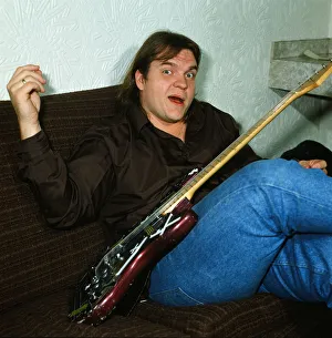 Musician Meat Loaf playing his guitar. September 1983 Musician Meat Loaf playing his guitar. September 1983